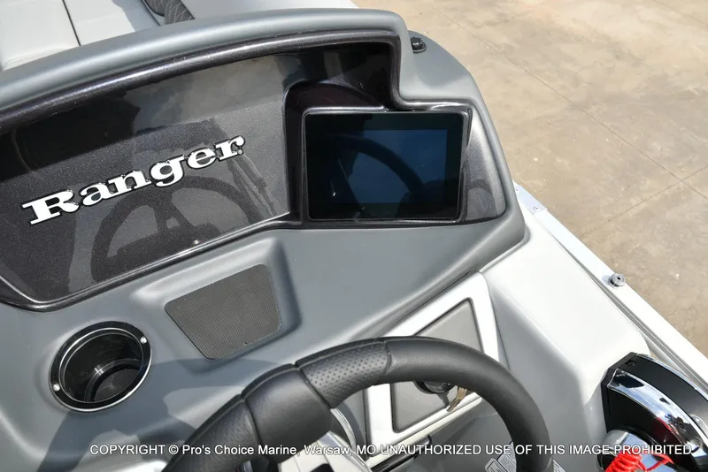 Slide: The Image of 2025 Ranger 223FC boat dashboard with steering wheel and display screen. - 41
