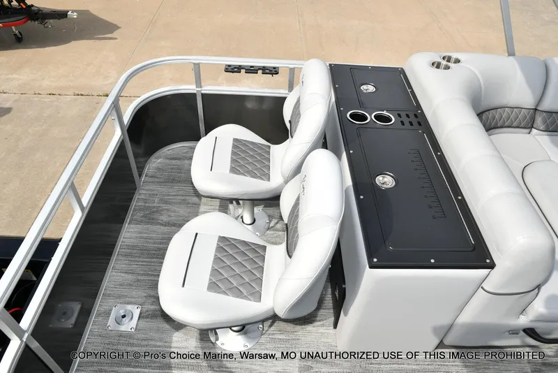 Slide: The Image of 2025 Ranger 223FC boat interior with seating and console, featuring modern design and amenities. - 45