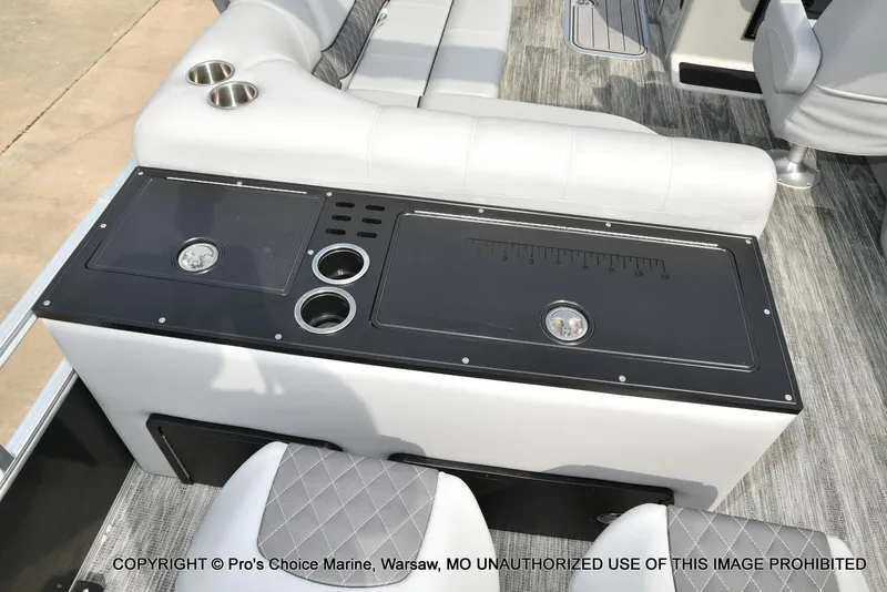 Slide: The Image of 2025 Ranger 223FC boat interior with seating and cup holders. - 47
