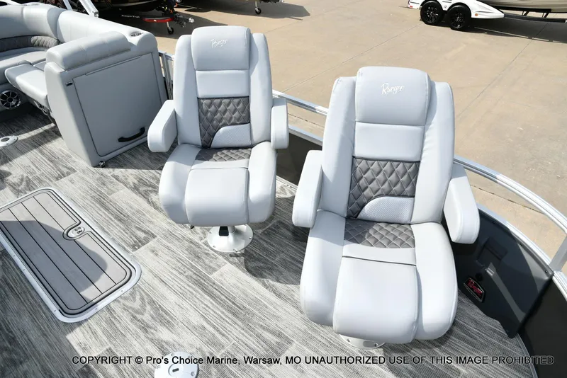 Slide: The Image of 2025 Ranger 223FC boat interior with plush seating and modern design. - 9