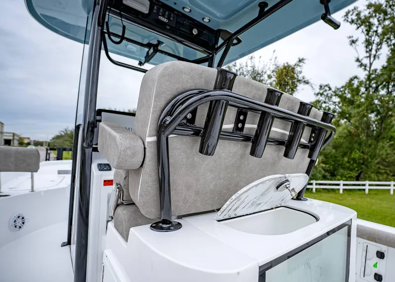 Slide: The Image of 2025 Sea Hunt BX 25 FS boat interior with rod holders and seating. - 11