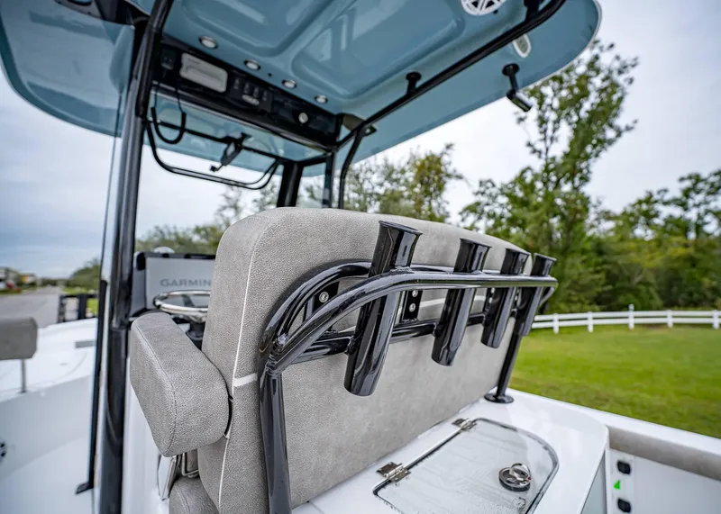 Slide: The Image of 2025 Sea Hunt BX 25 FS boat interior with rod holders and seating. - 12