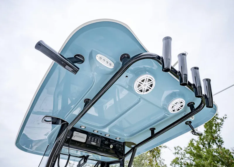 Slide: The Image of 2025 Sea Hunt BX 25 FS boat T-top with rod holders and speakers. - 13