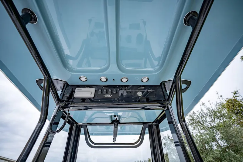 Slide: The Image of 2025 Sea Hunt BX 25 FS boat console with electronics and controls. - 15