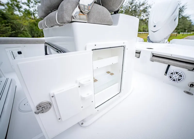Slide: The Image of 2025 Sea Hunt BX 25 FS boat storage compartment with open door. - 17