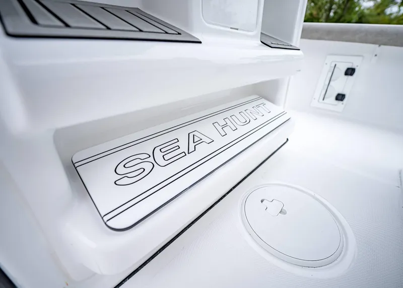 Slide: The Image of 2025 Sea Hunt BX 25 FS boat interior detail with logo. - 18