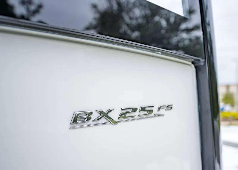 Slide: The Image of Close-up of 2025 Sea Hunt BX 25 FS boat emblem. - 21