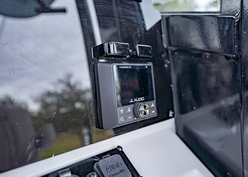 Slide: The Image of JL Audio system on 2025 Sea Hunt BX 25 FS boat dashboard. - 23
