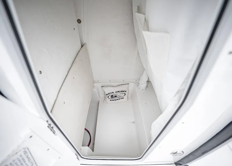 Slide: The Image of Interior storage compartment of 2025 Sea Hunt BX 25 FS boat. - 26