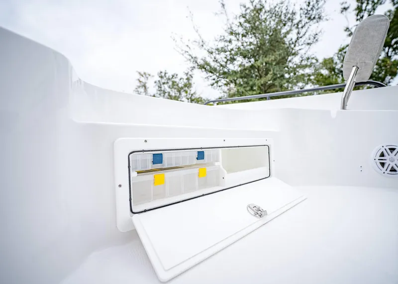Slide: The Image of 2025 Sea Hunt BX 25 FS boat storage compartment with open hatch. - 29
