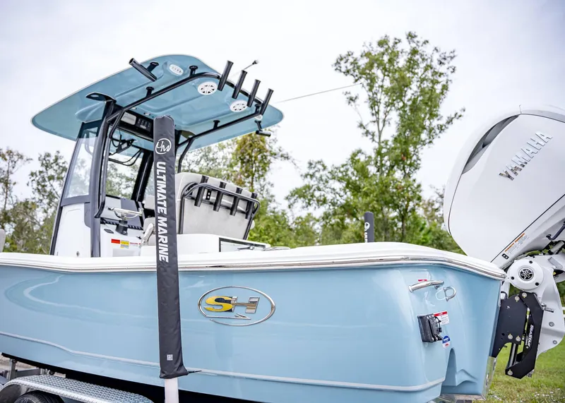 Slide: The Image of 2025 Sea Hunt BX 25 FS boat with Yamaha engine, blue hull, and fishing equipment. - 3