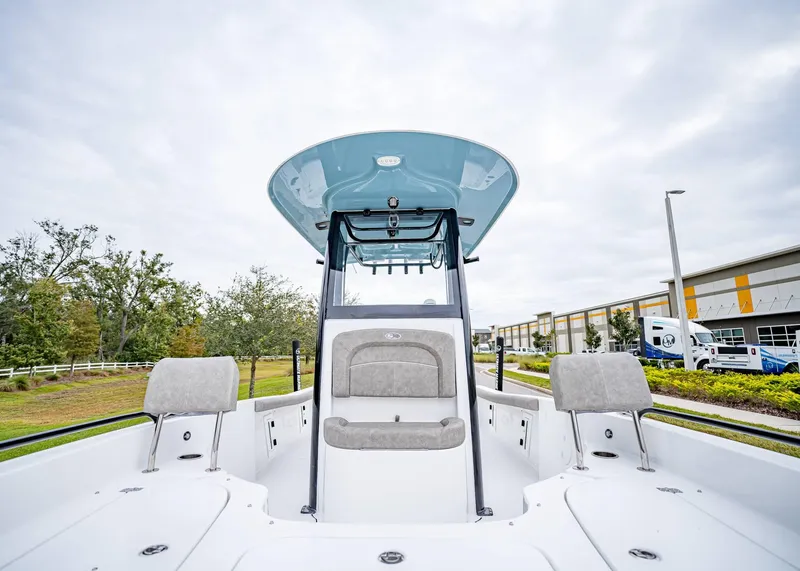 Slide: The Image of 2025 Sea Hunt BX 25 FS boat interior with seating and console, outdoors. - 31