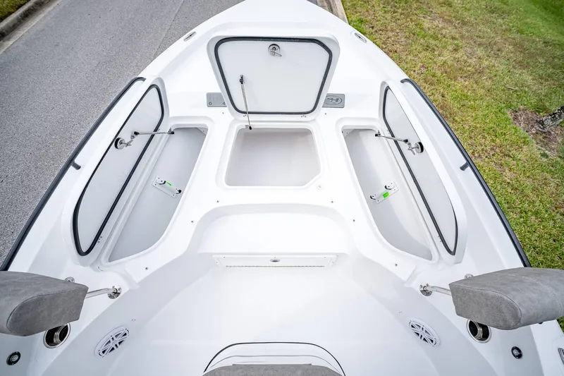 Slide: The Image of 2025 Sea Hunt BX 25 FS boat with open storage compartments and sleek design. - 34