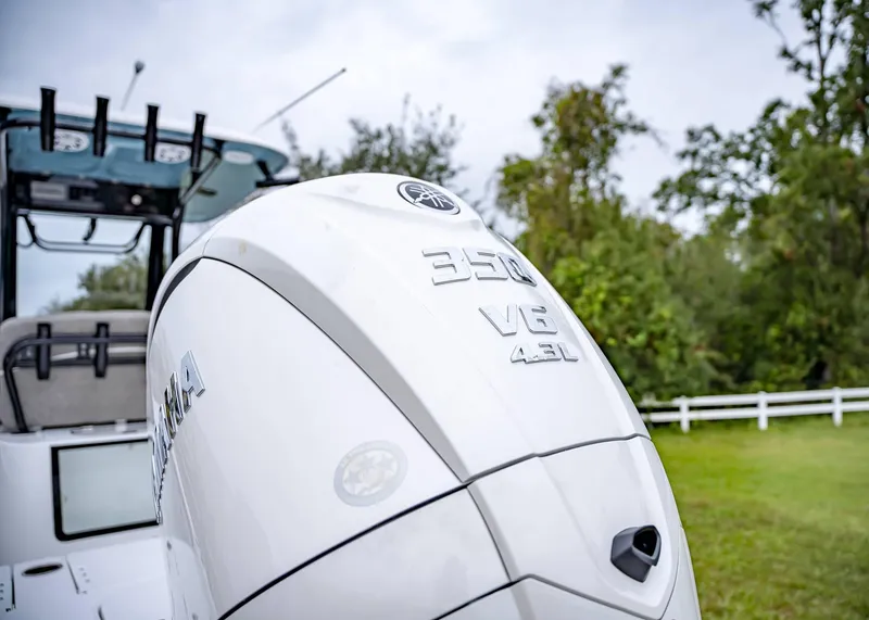 Slide: The Image of 2025 Sea Hunt BX 25 FS boat with Yamaha 350 V8 engine, outdoors. - 5