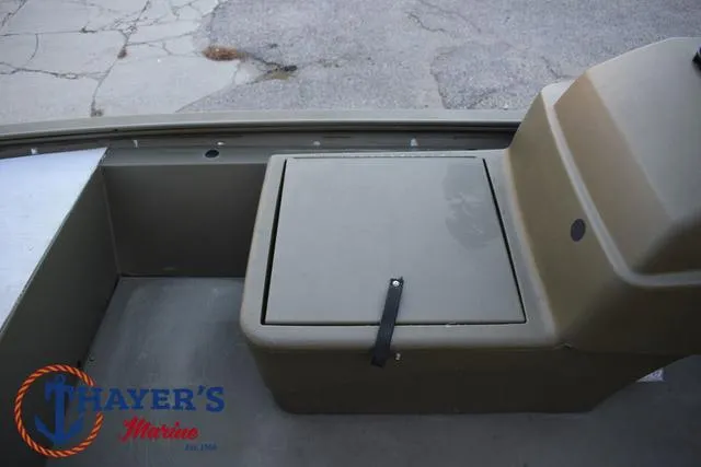 Slide: The Image of 2023 Tracker GRIZZLY® 1648 SC boat interior with storage compartment. - 16