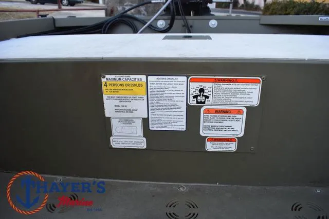 Slide: The Image of 2023 Tracker GRIZZLY® 1648 SC boat safety labels and capacity warnings. - 20