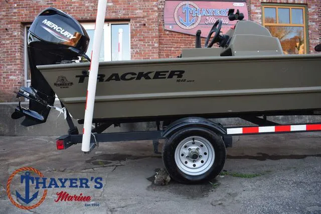 Slide: The Image of 2023 Tracker GRIZZLY® 1648 SC boat on trailer at Thayer's Marine. - 6