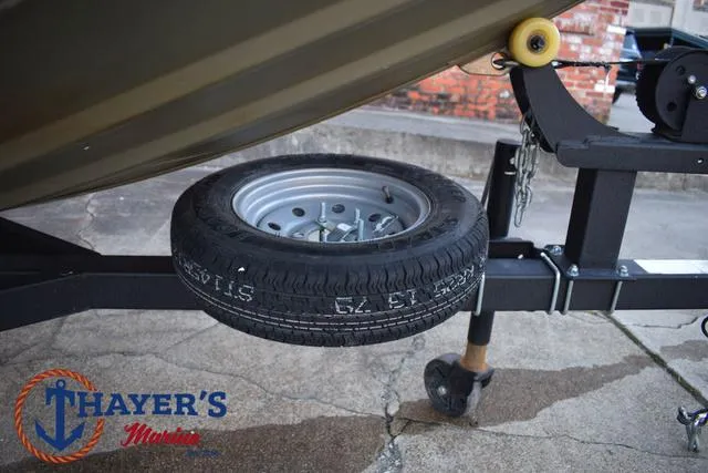 Slide: The Image of 2023 Tracker GRIZZLY® 1648 SC trailer with spare tire at Thayer's Marine. - 7