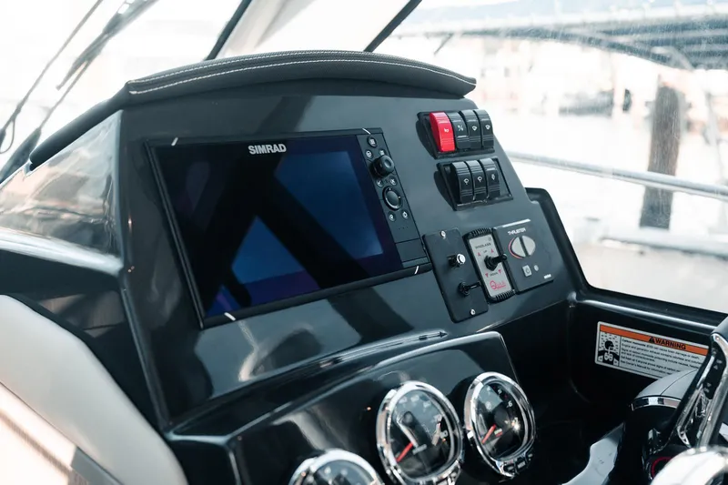 Slide: The Image of 2024 Bayliner Trophy T29EX dashboard with Simrad display and control panel. - 5