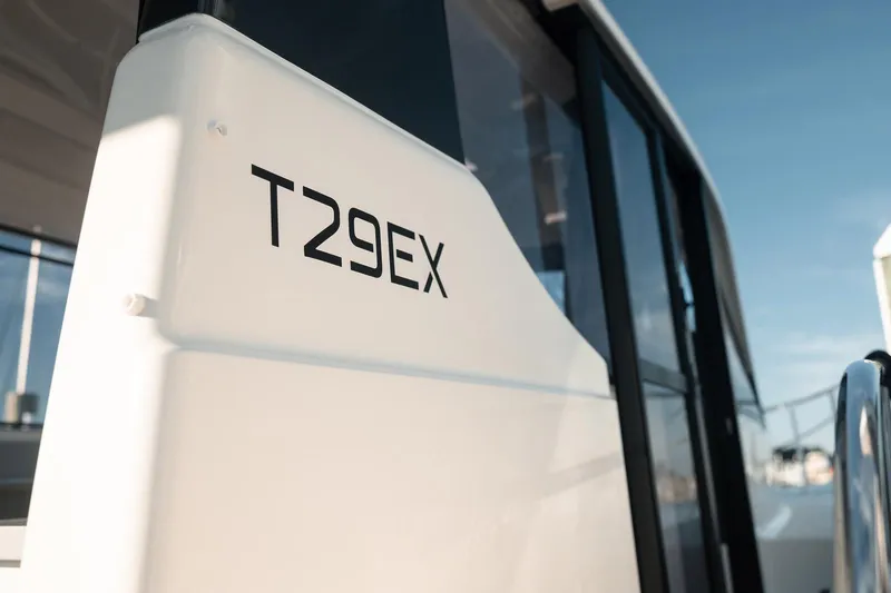 Slide: The Image of 2024 Bayliner Trophy T29EX boat exterior with model name visible. - 9