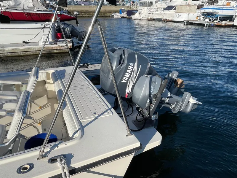 Slide: The Image of Boat docked with Yamaha outboard motor, Parker 2502 model, 2001. - 10