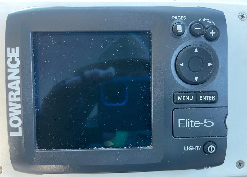 Slide: The Image of Lowrance Elite-5 fishfinder on a 2001 Parker 2502 boat dashboard. - 16