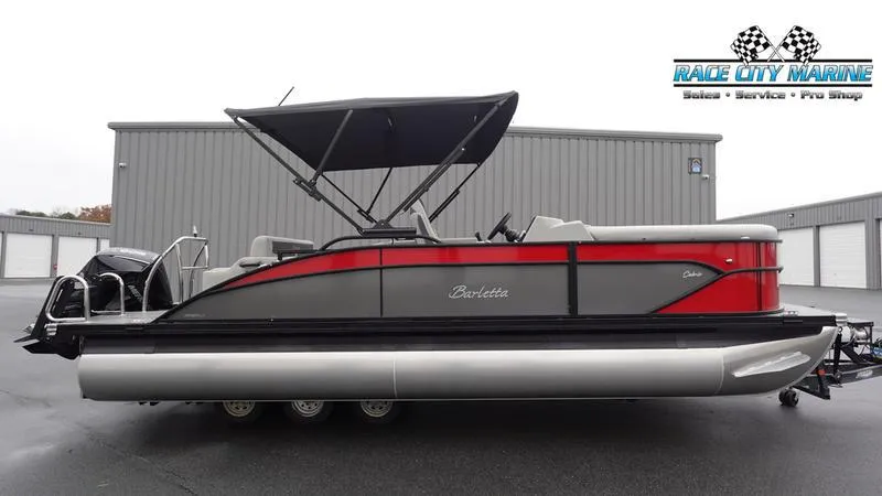 The Image of 2025 Barletta C22U pontoon boat with canopy, parked at Race City Marine. - 1