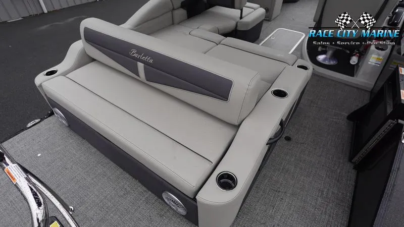 Slide: The Image of 2025 Barletta C22U boat interior with gray seating and cup holders. - 13