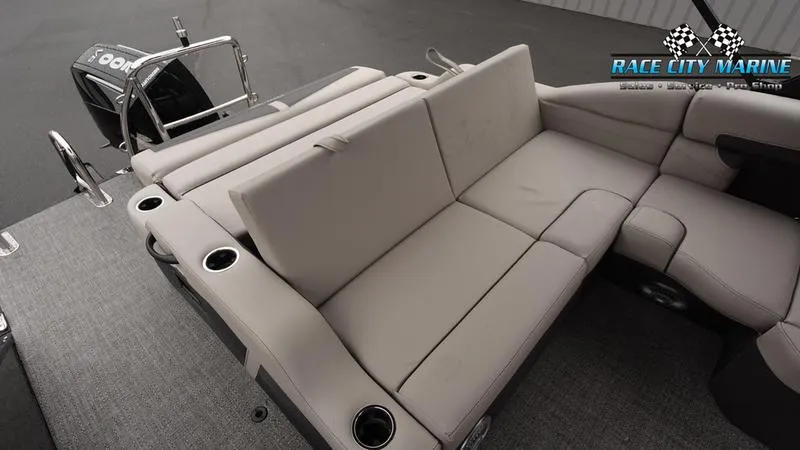 Slide: The Image of 2025 Barletta C22U boat interior with plush seating and cup holders. - 19