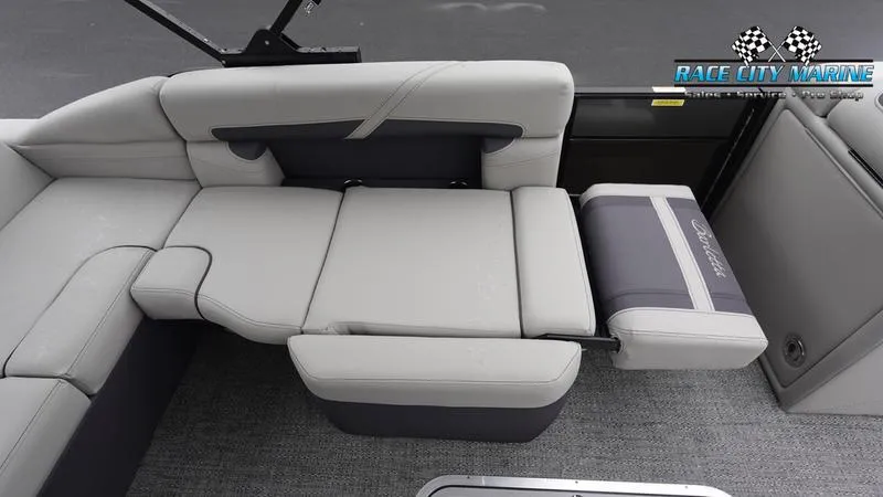 Slide: The Image of 2025 Barletta C22U boat interior with gray seating and Race City Marine logo. - 22