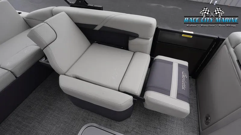 Slide: The Image of 2025 Barletta C22U boat interior with adjustable seating and Race City Marine logo. - 23