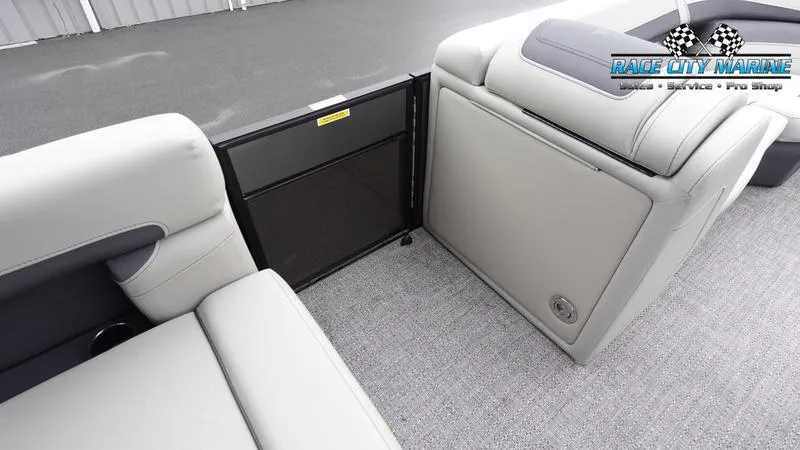 Slide: The Image of 2025 Barletta C22U pontoon boat interior with gray seating and flooring. - 26