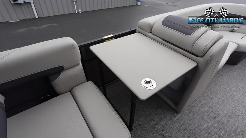 Slide: The Image of 2025 Barletta C22U pontoon boat interior with gray seating and table. - 29