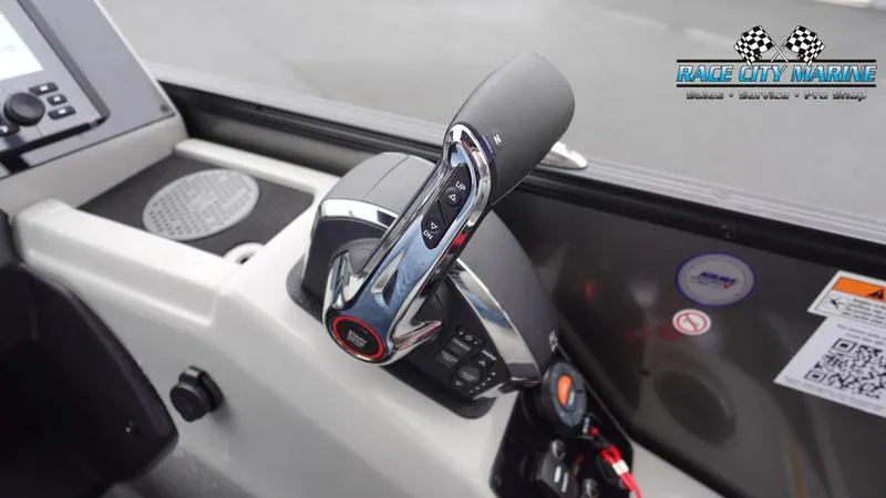 Slide: The Image of 2025 Barletta C22U boat control panel with throttle lever and dashboard details. - 33