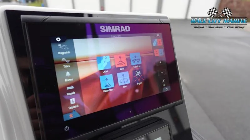 Slide: The Image of Simrad display on 2025 Barletta C22U boat dashboard, featuring navigation and control options. - 37