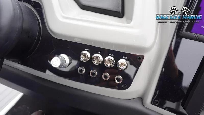Slide: The Image of Control panel of 2025 Barletta C22U boat with switches and Race City Marine logo. - 39