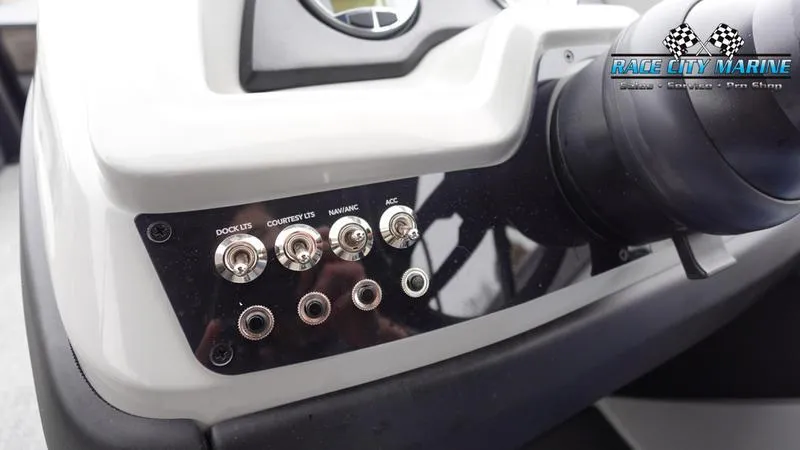 Slide: The Image of Control panel of 2025 Barletta C22U boat with labeled switches and Race City Marine logo. - 41