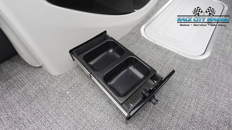 Slide: The Image of Barletta C22U 2025 boat interior with pull-out storage tray on carpeted floor. - 43