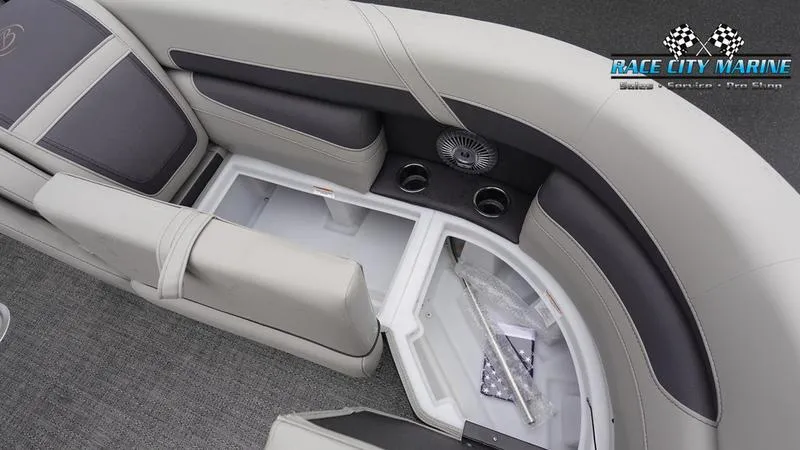 Slide: The Image of 2025 Barletta C22U boat interior with storage compartment and cup holders. - 49