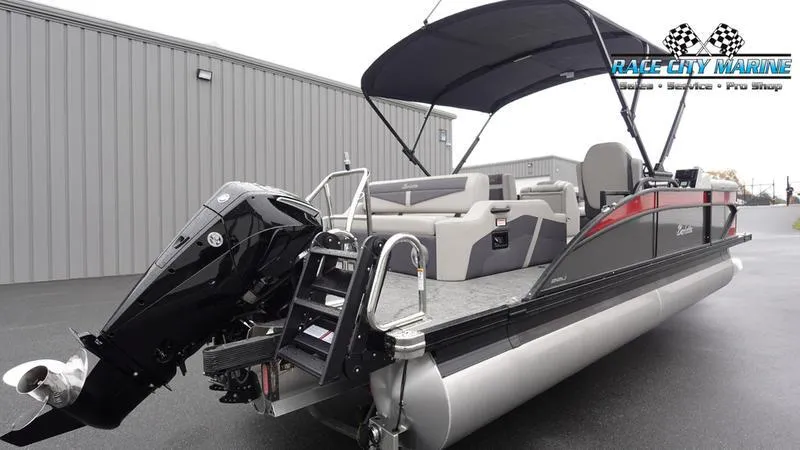 Slide: The Image of 2025 Barletta C22U pontoon boat with canopy and outboard motor at Race City Marine. - 8