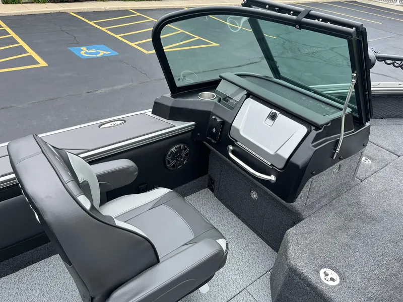 Slide: The Image of 2025 Lund 1975 Pro-V boat interior with sleek seating and modern dashboard design. - 11