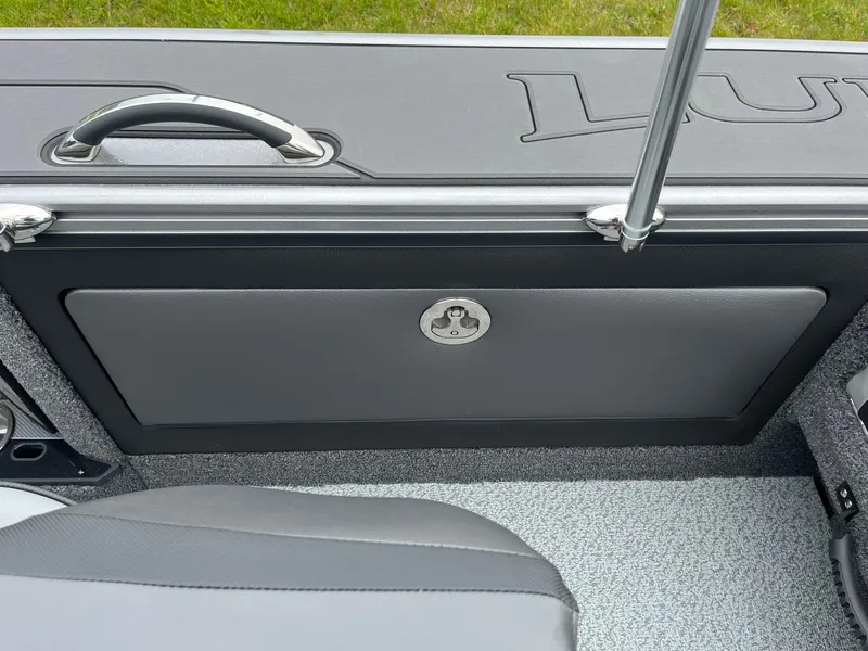 Slide: The Image of 2025 Lund 1975 Pro-V boat interior with sleek gray paneling and seating. - 22