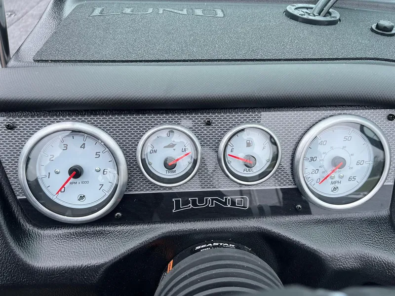 Slide: The Image of Dashboard of 2025 Lund 1975 Pro-V boat with gauges and controls. - 28