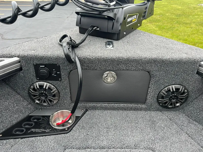 Slide: The Image of 2025 Lund 1975 Pro-V boat interior with speakers and trolling motor. - 32