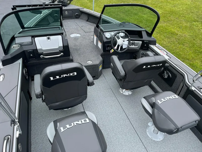 Slide: The Image of Interior of 2025 Lund 1975 Pro-V boat with four seats and steering console. - 7