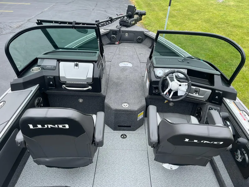 Slide: The Image of 2025 Lund 1975 Pro-V boat interior with dual seats and modern dashboard. - 8