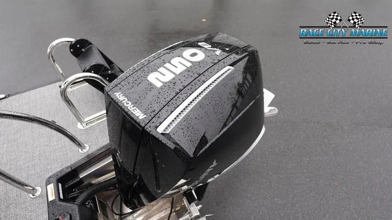 Slide: The Image of Barletta C22UC 2025 boat with Mercury outboard motor in rainy weather. - 11