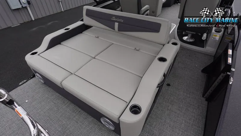 Slide: The Image of 2025 Barletta C22UC pontoon boat interior with gray seating and cup holders. - 13