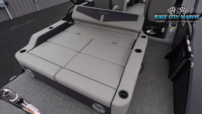 Slide: The Image of 2025 Barletta C22UC boat interior with spacious seating and cup holders. - 14