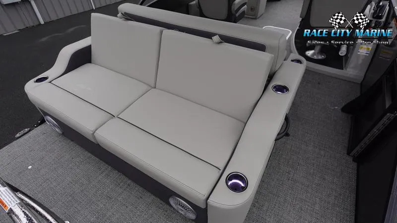 Slide: The Image of 2025 Barletta C22UC boat interior with gray seating and cup holders. - 16